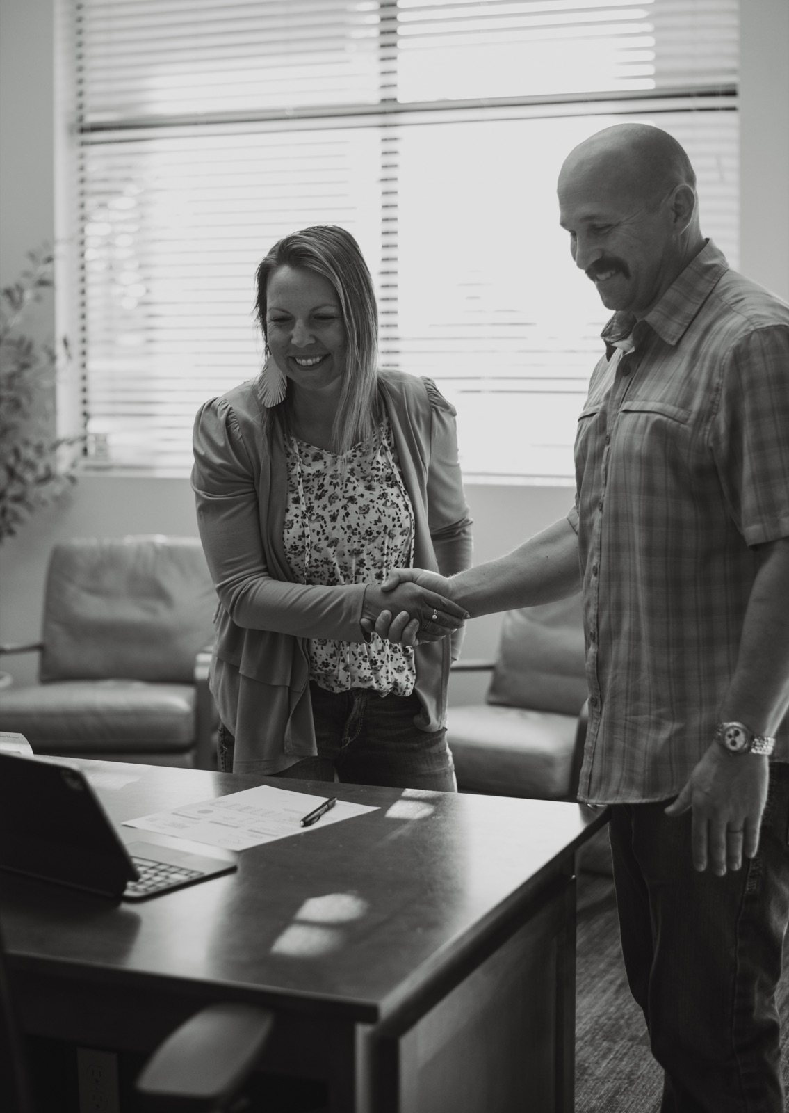 Caleb Krantz shaking hands with a business owner after a merchant services consultation